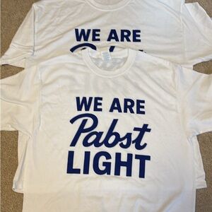 2 UNISEX Pabst Light White and Blue T-Shirts one is L one is XL